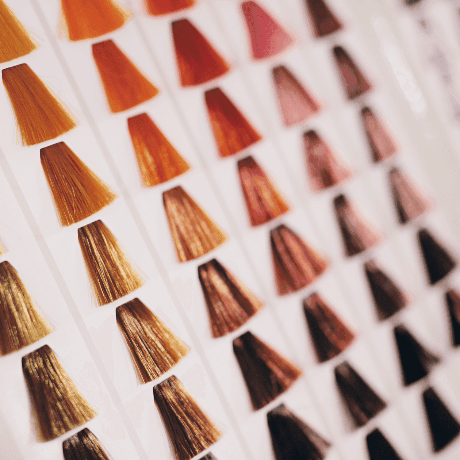 Hair color swatches displaying various shades of orange, red, and brown.